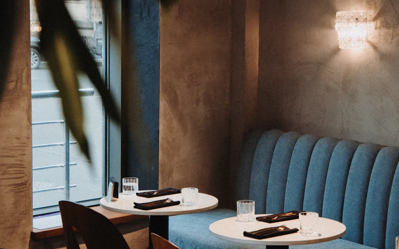 A quiet corner banquette set for two