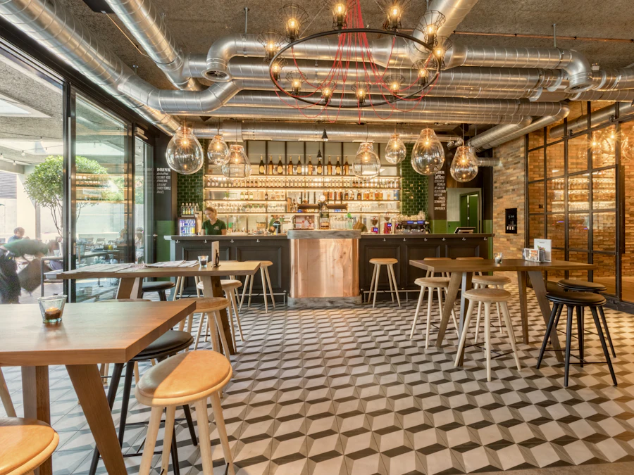 The bar and tiled floor, stools pulled up, mid-afternoon