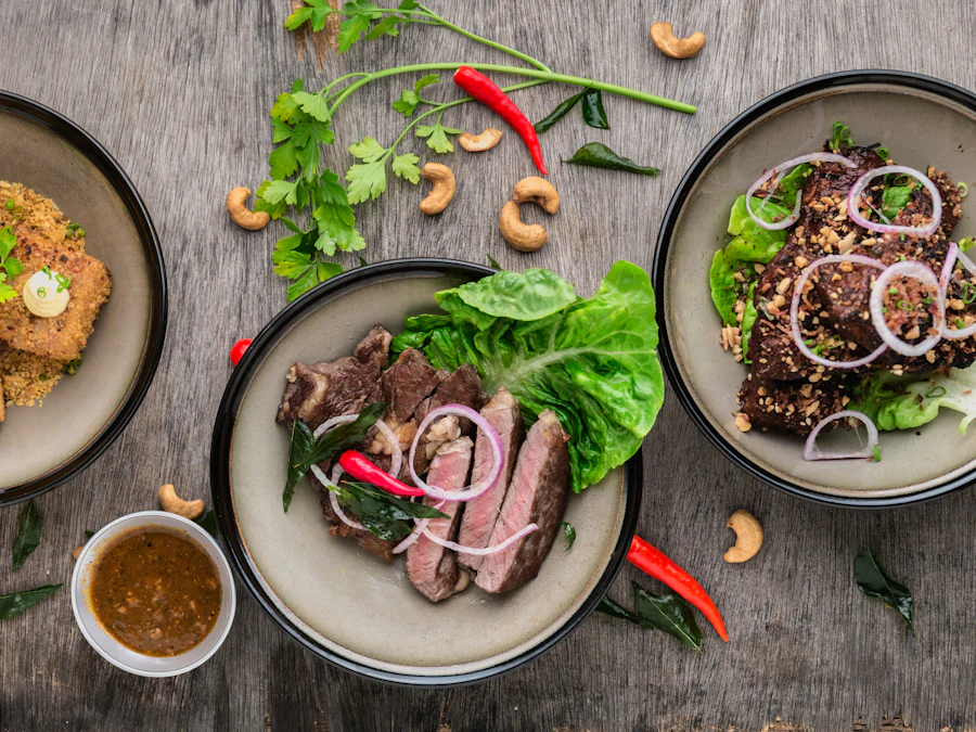 Small plates spread across the table from above, herbs and dipping sauce